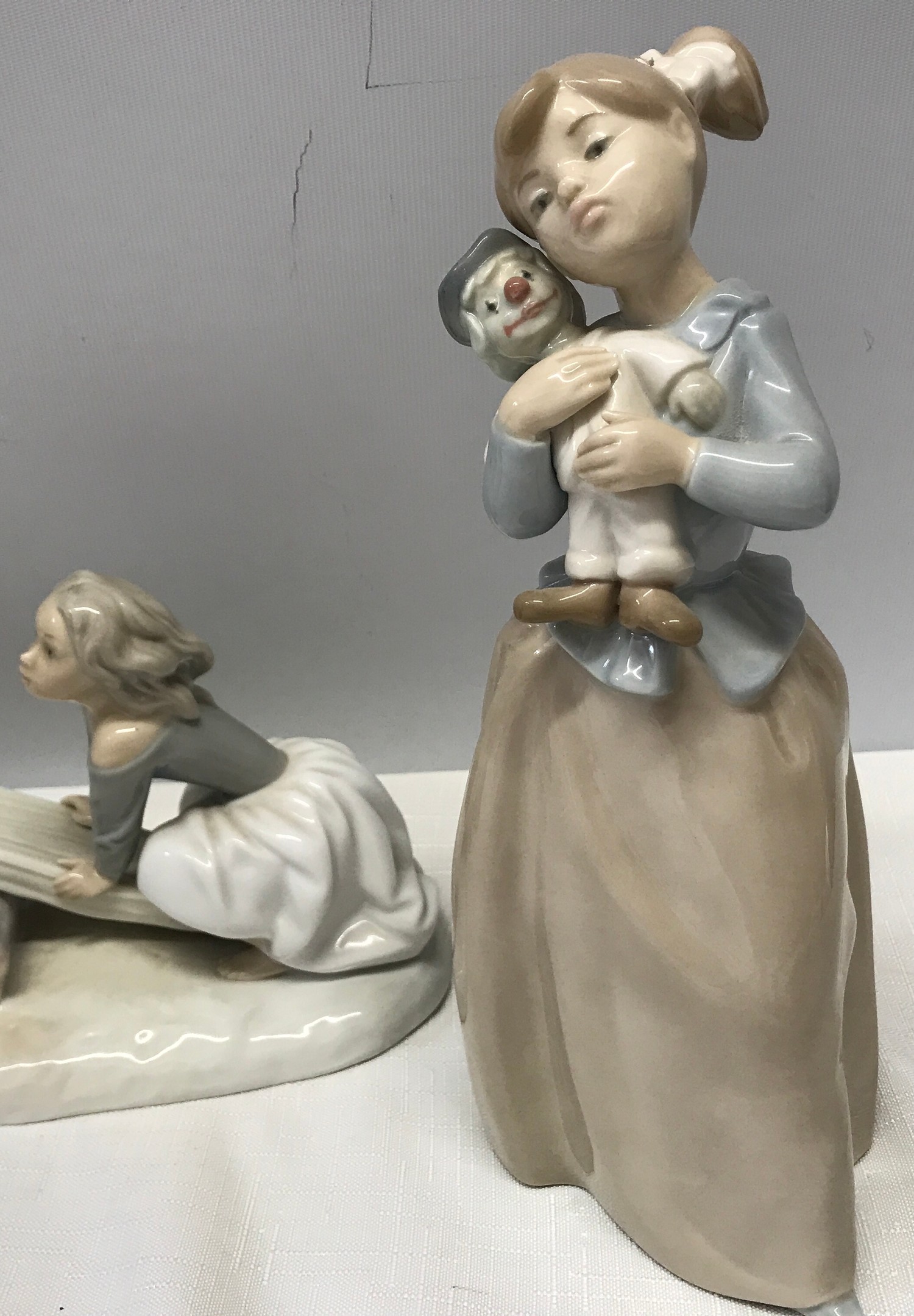 Three Nao Lladro figurines : Girl with Clown Doll 22.5cms h, Boy with Dog 23cms h and Boy and Girl - Image 2 of 6