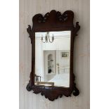 A 19thC mahogany wall mirror. 85 h x 52cms w.Condition ReportGood condition.