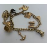 A 9ct yellow gold charm bracelet with 9 various charms. 33.2gms.Condition ReportGood condition.
