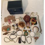 A selection of costume jewellery to include bangles, bracelets, earrings and brooches.Condition