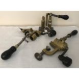 Three brass shotgun cartridge vice re loaders, one James Dixon and Sons, cast iron base, two lever