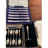 A boxed set of 6 silver teaspoons, Birmingham 1944, a fitted box with silver baby food pusher,