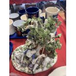 A 19thC Meissen figural group. 22cms h.Condition ReportSome chips to leaves and branch.