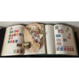 Two stamp albums filled with British and commemorative stamps with some loose stamps.Condition
