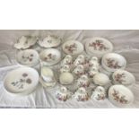 A quantity of Wedgewood dinnerware. Twenty one pieces of "Flame Rose" to include: 6 dinner plates