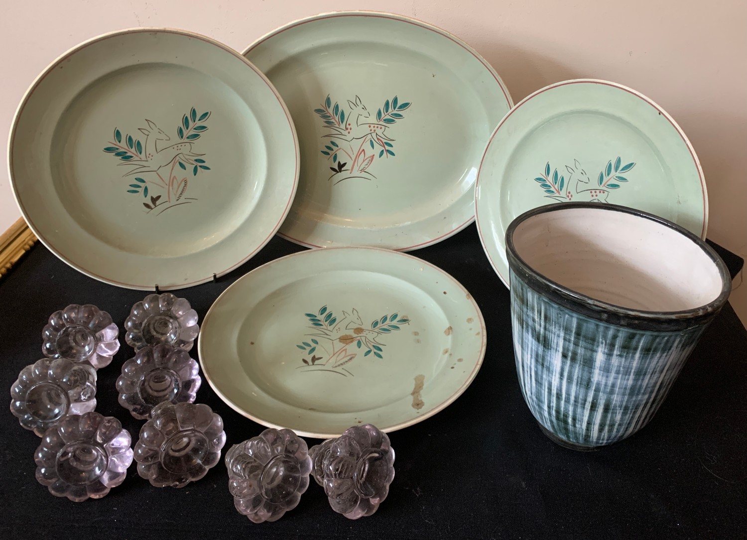 Four Poole pottery plates, 8 glass knobs and a Rye pottery plant pot.Condition ReportOne plate