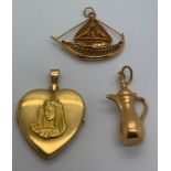 An 18ct heart shaped locket depicting The Virgin Mary with an 18ct gold coffee pot charm and an 18ct