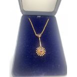 A 9ct gold drop pendant on chain set with garnets, chain 46cms l. 3.1gms total.Condition