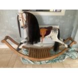 A large modern rocking horse with horse hair mane and tail.Condition ReportGood condition apart from
