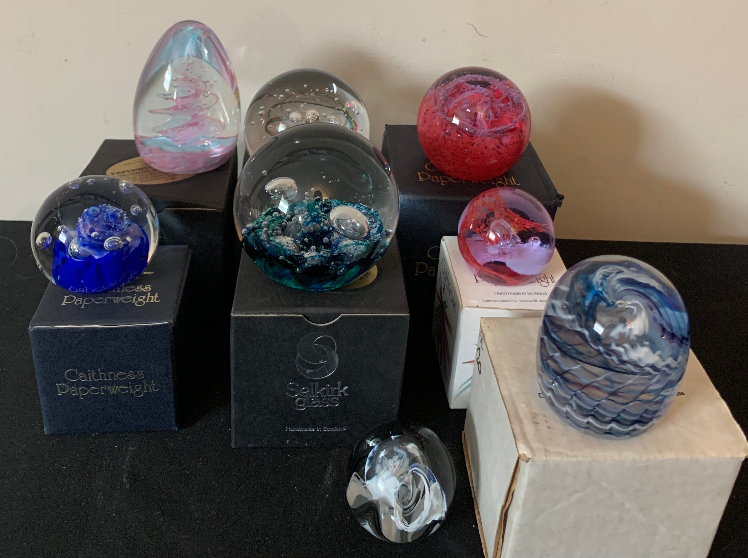 Eight glass paperweights including Selkirk, Caithness and Sanders & Wallace.Condition ReportAll good