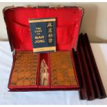 A vintage Mahjong set with wooden tile holders.Condition ReportUsed.