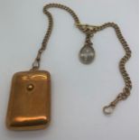 A 19thC gold plated watch chain with T bar, vesta case and HRH Arbert in memoriam photograph.