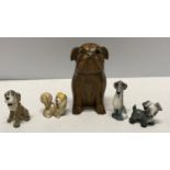 A carved wood bulldog ink well with inner ink pot 11.5cms h and four Wade Disney characters.