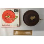 A Swordfish 15m leather measuring tape with original box together with a wooden technical 14cm ruler