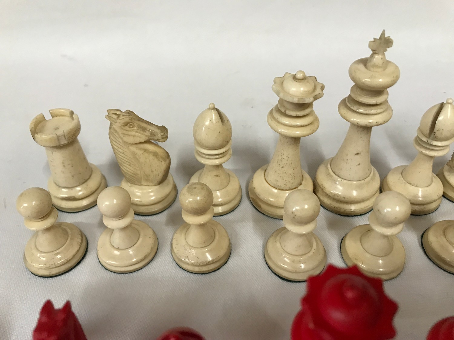 A carved bone red and white chess set. Complete.Condition ReportOne red pawn with glued tip. Overall - Image 4 of 6