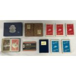 A collection of 10 decks of playing cards with colourful backs.Condition ReportMajority new and