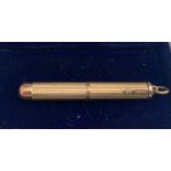 A 9ct gold engine turned cigar pricker, Birmingham 1970, maker possibly Cohen and Charles. 5.9gms.