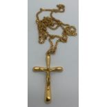 An 18ct gold crucifix and chain, chain 60cms 15.2gms total weight.Condition ReportGood condition.