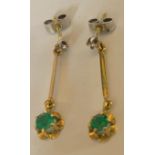 A pair of 18ct gold drop earrings set with diamonds and emeralds. 1.8gms total weight.Condition