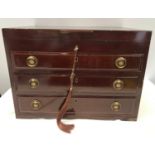 A walnut veneered canteen chest of silver plated cutlery by Hugh Foulerton Heswall England. Three