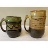 Two Pat Groom Winchcombe Pottery mugs. 15cms and 11.5cms h.