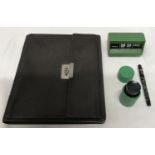 A writing collection to include a dark brown leather writing case with outer side pocket and inner