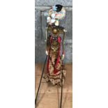 A Chinese painted puppet with decorative traditional dress.Condition ReportSome paint loss to hat