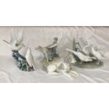A group of Lladro and Nao Llado figures to include: Nao Grey and White Dog 10cms h x 18,5cms l,