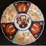 An Imari pattern plate, 31cms d.Condition ReportHairline crack to rear and repair to front.