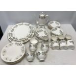 A part set of Crown Staffordshire floral patterned dinner and tea ware to include 2 meat plates