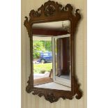 A mahogany framed fretwork wall mirror. 83 h x 48cms w.Condition ReportVeneer loss to top.
