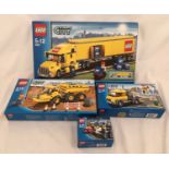 A Lego City Delivery Truck 3221, Construction Truck 7631, Street Light Truck 3179 and a Police