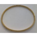 A 9ct gold bangle. Weight 5gms.Condition ReportGood condition.