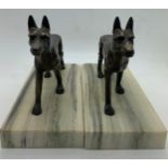 Two bronze dogs on marble bases, 12.5cms h.Condition ReportSight wear to patination.