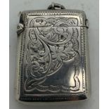 A hall marked silver vesta case with foliate scroll engraving. Chester 1903 maker AC. 21gms.