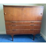 A Merridew teak desk with 2 short over 2 long drawers. 111cms h x 119.5cms w x 45cms d.Condition
