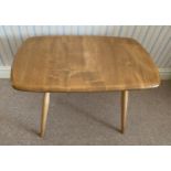 An Ercol occasional table with original blue paper badge. 68.5cms x 42cms x 43.5cms h.Condition