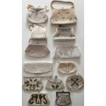 A collection of 13 white coloured handbags with beads and sequins in various designs and shapes. One