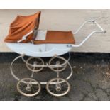 A mid 20thC dolls pram with original cover and hood. 85 l x 85cms h.Condition ReportSome rust to