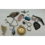 A selection of jewellery to include silver and enamel lady's pocket watch etc. In a wood and brass