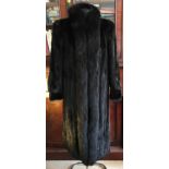 A dark chocolate brown mink long length coat in a 1940's style with long stand up collar to