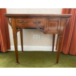 Edwardian mahogany desk/card table. 83 w x 45 d x 776cms h. Baize lining on square tapered legs.