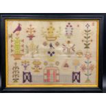 A 19thC cross stitch sampler in ebonised frame. 34 x 47cms.Condition ReportGood condition.