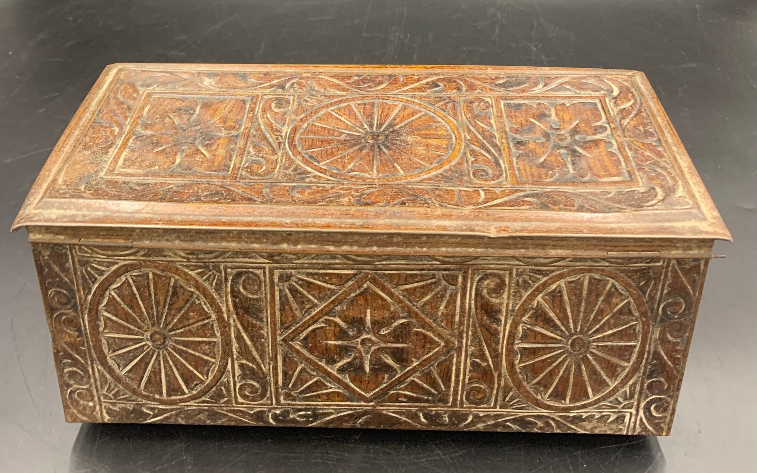 A vintage biscuit tin in the form of a carved oak coffer. 27 x 12 x 12cms h.Condition ReportGood - Image 3 of 6