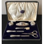 A boxed silver manicure set by William Aitken, Birmingham 1912.Condition ReportBreak to the brush,