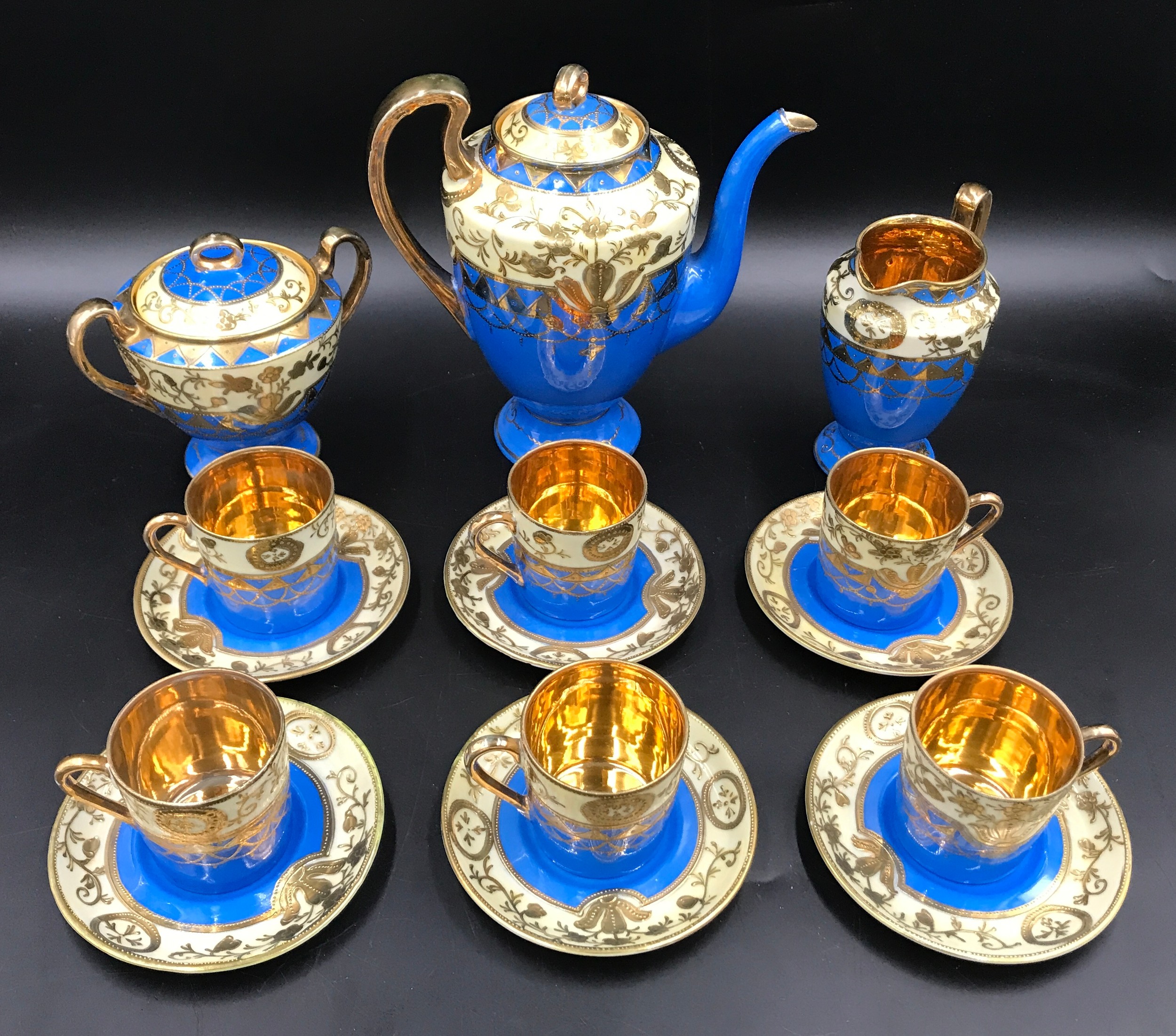 A Japanese Samurai China 15 piece coffee set with blue ground and gilt decoration. Coffee Pot