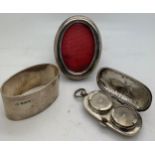 Oval silver frame, Chrisford & Norris Ltd, Birmingham 1901, napkin ring, Sheffield 1925, 64gms and