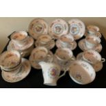 A Shelley tea service comprising 10 cups, 11 saucers, 12 plates, milk and sugar.