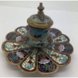 A brass and enamel champlevé inkwell 7.5cms h with glass liner.Condition ReportGood condition.