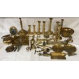 A large selection of brassware to include candlesticks, ornaments, bowl, bell, teapot etc.